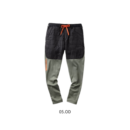 アタックベース（ATACK BASE）49582 HUMMER レヴスキンズインサレーションパンツ 05.ODの正面商品画像。ブラックの中綿入り太もも部分とオリーブグリーンの膝下を組み合わせたバイカラーデザイン。オレンジのドローストリングと右脚プリントがアクセント。防風・保温・ストレッチ性を備えた秋冬用ワークパンツ。建設作業・農作業・アウトドア・キャンプにもおすすめ。