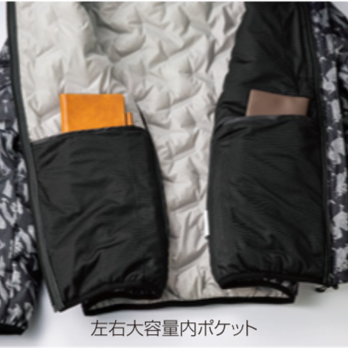 クロダルマ KURODARUMA 54377 シームレスストレッチ防寒ジャケット｜左右大容量内ポケットの拡大画像。財布やスマートフォンなどの小物を収納できる便利な内ポケットを備えた、軽量・撥水・防風・保温仕様の秋冬用防寒作業服